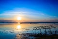 Sunset sky over lake or river and home with flood Royalty Free Stock Photo