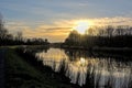 Sunset sky over river Scheldt in the flemish countryside Royalty Free Stock Photo