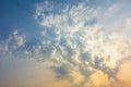 sunset sky with rays of light shining down pass clouds and sky