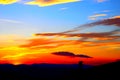 Sunset sky of red, yellow and blue color spectrum with clouds in Monte Vidon Corrado Royalty Free Stock Photo