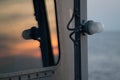 Sunset sky Reflect on the navy ship`s window Royalty Free Stock Photo