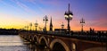 The sunset sky scene of the Pont de pierre at sunset in the famous winery region Bordeaux, France Royalty Free Stock Photo