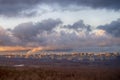 Sunset sky with storm clouds over the city and forest Royalty Free Stock Photo