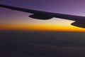 Sunset sky under wing of airplane Royalty Free Stock Photo