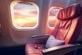 Sunset sky view from plane window in economy seat. Economy class airplane window. Inside of commercial airline. Seat with armchair Royalty Free Stock Photo