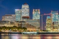 Sunset skyline of Canary Wharf, London reflections