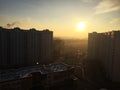 Sunset among skyscrapers. Beautiful house is illuminated by sunlight. Details and close-up.