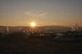 Sunset with smoke and condensation trails