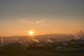 Sunset with smoke and condensation trails