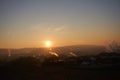 Sunset with smoke and condensation trails