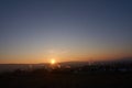 Sunset with smoke and condensation trails