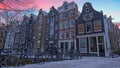 Sunset in snowy Amsterdam in winter in the Netherlands