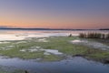 Sunset and soft shades pf pink and green over the Lake