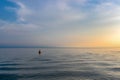 Sunset at the source of the Angara River from Lake Baikal. Baikal port and mountains. Siberia, Russia