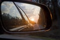 sunset in a traffic jam on the road through the right side mirror in the car Royalty Free Stock Photo