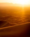 Sunset and speeding car from sand dunes in Erg Chebbi, Morocco