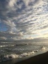 Sunset in Spring at Black Sand Beach in Kekaha on Kauai Island, Hawaii - Niihau Island in Horizon. Royalty Free Stock Photo