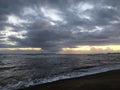 Sunset in Spring at Black Sand Beach in Kekaha on Kauai Island, Hawaii - Niihau Island in Horizon. Royalty Free Stock Photo