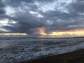 Sunset in Spring at Black Sand Beach in Kekaha on Kauai Island, Hawaii - Niihau Island in Horizon. Royalty Free Stock Photo