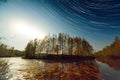 Sunset and Star Trails Over Lake Royalty Free Stock Photo