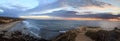 Sunset in a stone overlook that views Crystal Cove State Park Be