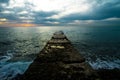 Sunset on a stone pier. Royalty Free Stock Photo