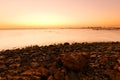 Sunset, stones and shoreline Royalty Free Stock Photo