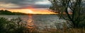 Scenic panorama view of a sunset over Sweet Briar Lake, North Dakota.