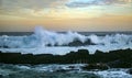 Sunset and storm waves on the ocean coast Royalty Free Stock Photo