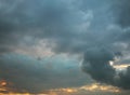 Sunset in stormy dark grey clouds Royalty Free Stock Photo