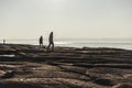 Sunset Stroll: People Walking Along Sirmione\'s Picturesque Coastline