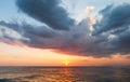 Sunset on a summer day with beautiful clouds at Praia da Barra da Tijuca Beach, Rio de Janeiro, Brazil.