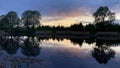 Sunset on a summer evening on the pond Royalty Free Stock Photo