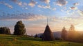 Sunset on summer mountainous green meadow with stack of hay Slavske village, Carpathian Mts, Ukraine