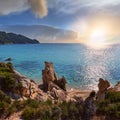 Sunset summer sandy beach and rocky coast near Platanitsi Beach, Sithonia Peninsula, Chalcidice, Greece Royalty Free Stock Photo