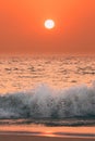 Sunset Sun Above Sea. Natural Sunrise Sky Warm Colors Over Ripple Sea. Ocean Water Foam Splash Washing Sandy Beach At Royalty Free Stock Photo