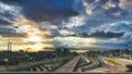 Sun behind the clouds over the highway