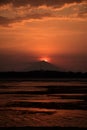 Sunset with sun behind mount Agung silhouette Royalty Free Stock Photo