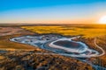 Sunset over agricultural land and desert. Royalty Free Stock Photo