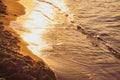 Sunset - sun reflecting in waves, shore Royalty Free Stock Photo