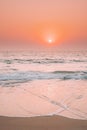 Sunset Sun Shine Above Sea. Natural Sunrise Sky Warm Colors Over Ripple Sea. Ocean Water Foam Splashes Washing Sandy Royalty Free Stock Photo