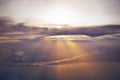 Sunset sunrays shining through the clouds onto the Florida peninsula and Atlantic ocean seen form flying above from the cockpit of Royalty Free Stock Photo