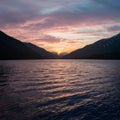 Sunset or sunrise over the lake creates mesmerizing natural backdrop Royalty Free Stock Photo