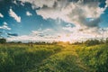 Sunset, Sunrise Over Rural Meadow. Dramatic Sky And Country Road Royalty Free Stock Photo