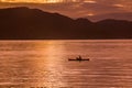 Sunrise with reflections at Lake Toba, Samosir Island, Indonesia. Royalty Free Stock Photo