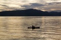 Sunrise with reflections at Lake Toba, Samosir Island, Indonesia. Royalty Free Stock Photo