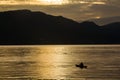 Sunrise with reflections at Lake Toba, Samosir Island, Indonesia. Royalty Free Stock Photo