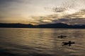 Sunrise with reflections at Lake Toba, Samosir Island, Indonesia. Royalty Free Stock Photo