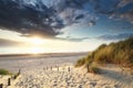 Sunset sunshine over sand path to North sea beach Royalty Free Stock Photo