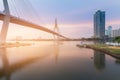 Sunset suspension bridge crossing Bangkok river Royalty Free Stock Photo